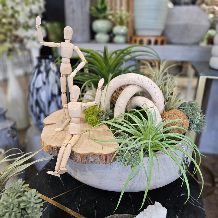 Marble Arches with Tillandsia, Natural Fiber Spheres with Wood Slice and Posable People in Concrete Bowl  20"H