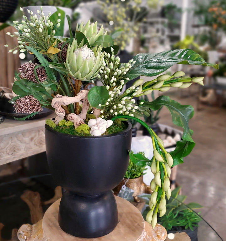 Queen Protea, Agapanthus, Banksia, Orchid Buds, Tropical Leaves and Succulents in Container. 30"H