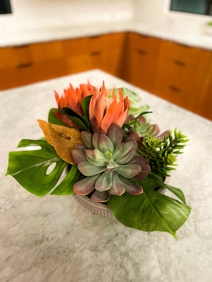 Protea with Succulents and Tropical Leaves in Ceramic